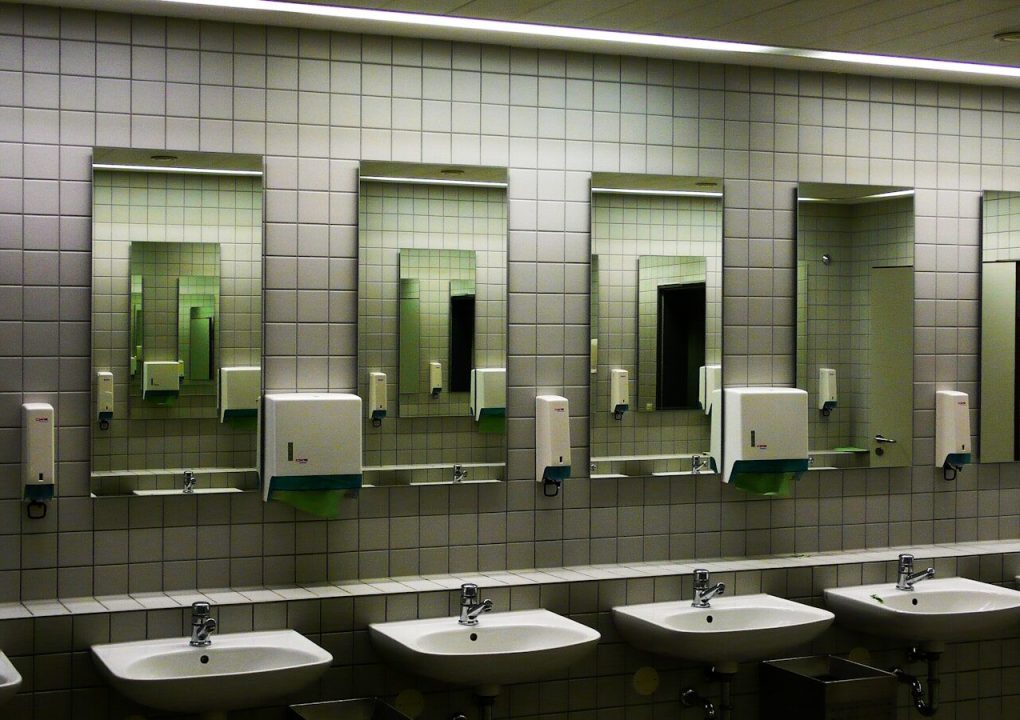 white ceramic sink with faucet